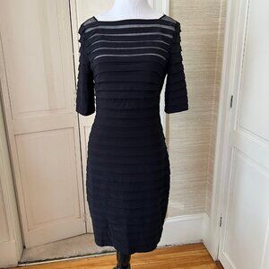 Black cocktail dress with sheer panels